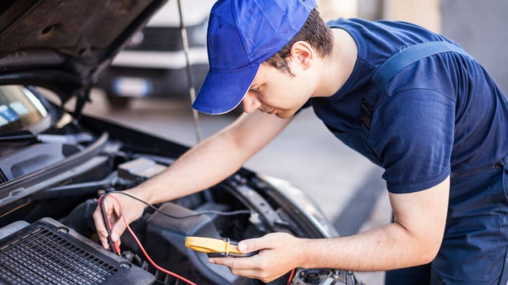 Electric Vehicle Technician doing work on an Electric car